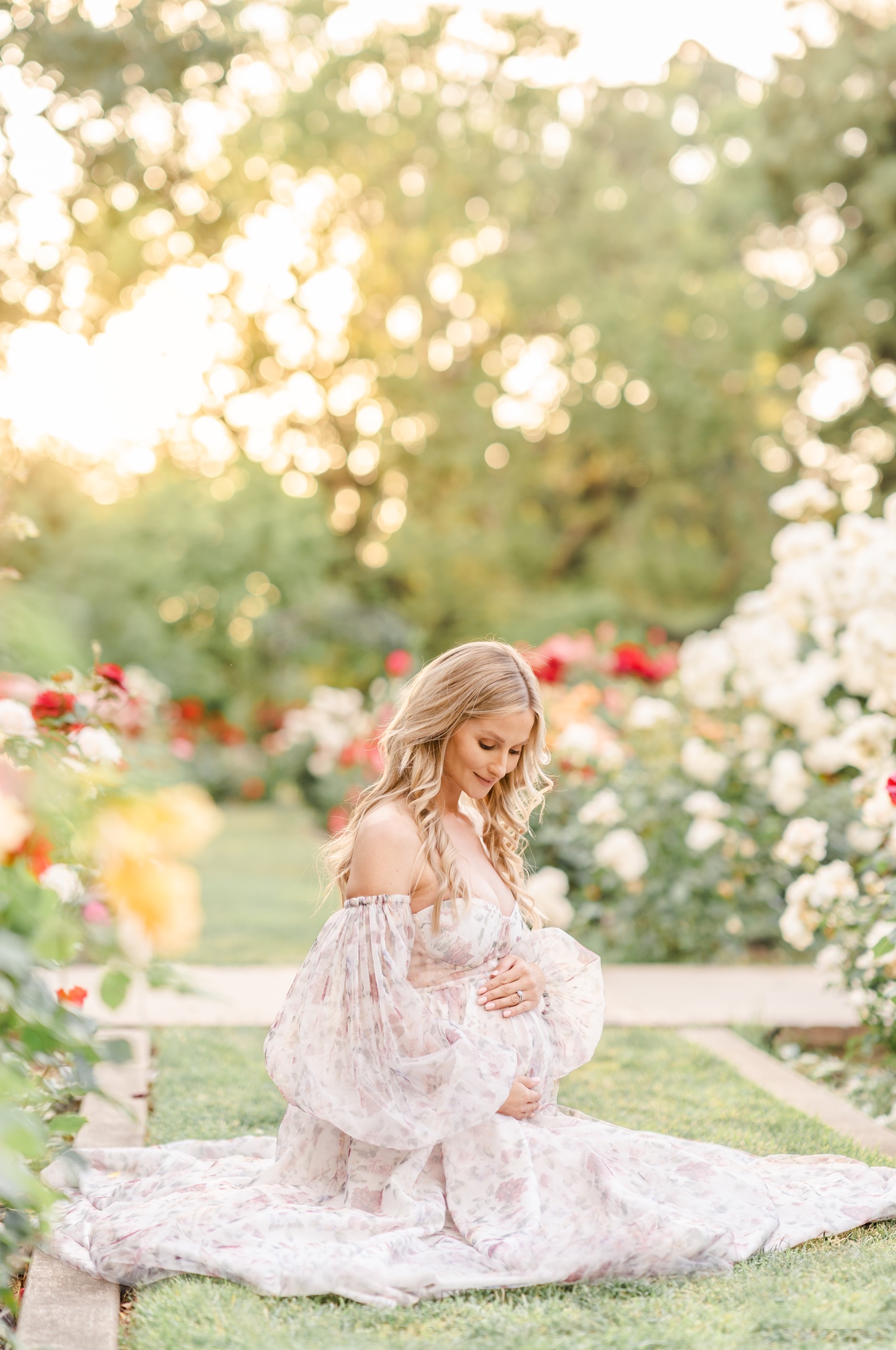 Woman Wearing a Pink Dress Sitting in a Garden · Free Stock Photo