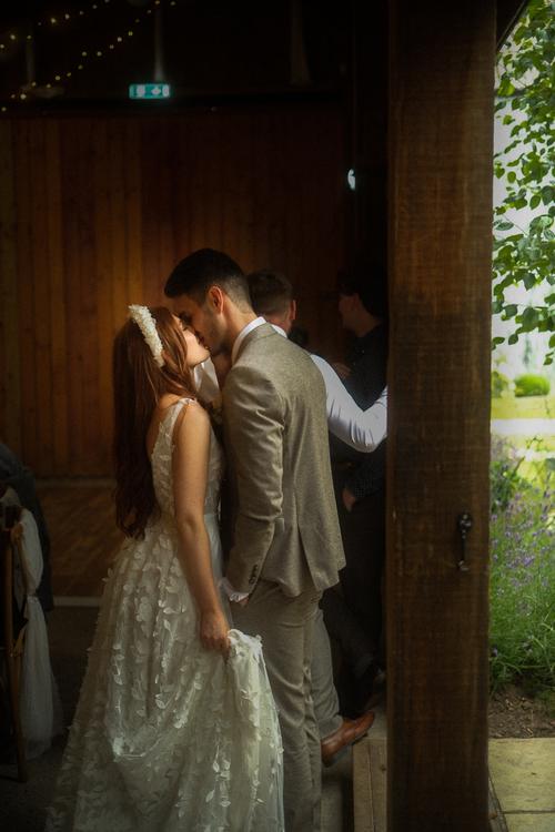 Bride and groom kisss