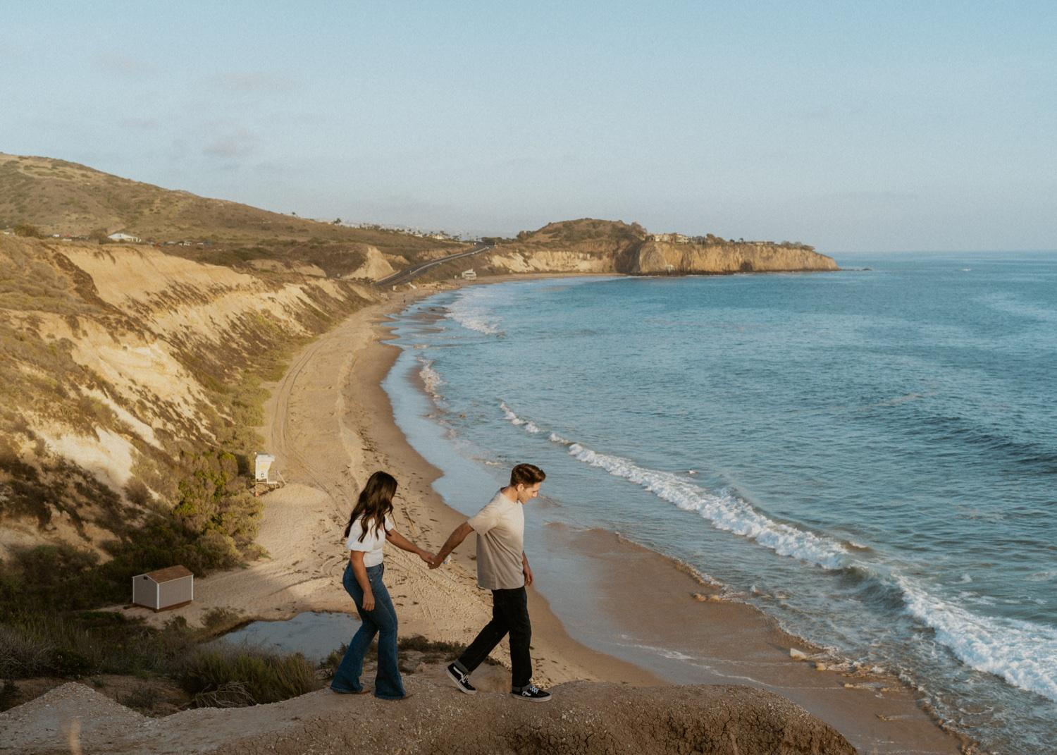 https://fetch.getnarrativeapp.com/static/6b098eef-83be-4d6d-8150-a65696914b3e/An-engagement-session-shot-at-Crystal-Cove-in-Laguna-Beach,-California-at-dusk-with-film-inspiration.-Shot-by-Ria-Georgia-Photography..jpg?w=1500