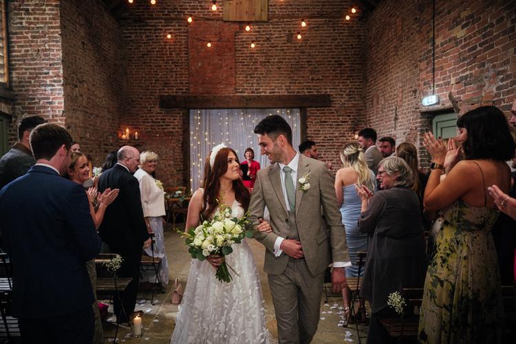 Bride and groom walk back down the aisle Wedding ceremony at the barns east yorkshire